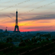 People gathered to watch the sunset with the Eiffel Tower in the backdrop