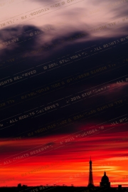 Crimson Cloak: Parisian Landmarks at Sunset