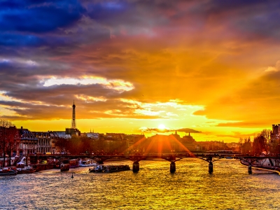 Radiant sunset over the Seine River with the Eiffel Tower and bridges of Paris