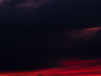 Crimson Cloak: Parisian Landmarks at Sunset